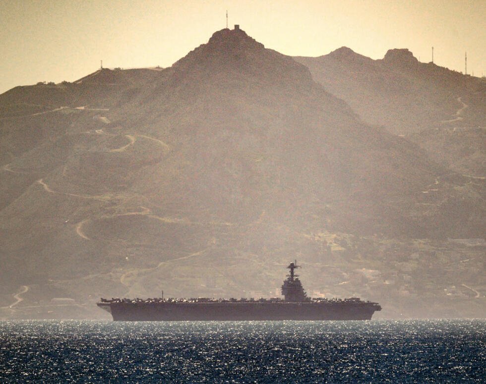 US aircraft carrier USS Gerald Ford heading through the Strait of Gibraltar as seen from Gibraltar, on February 20, 2026