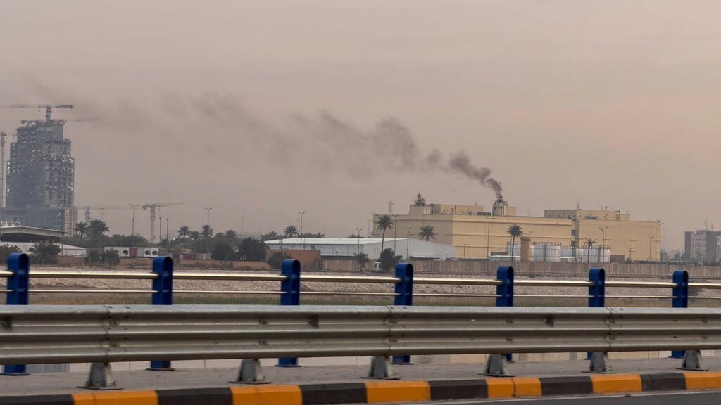 Smoke rises from the US embassy building in Baghdad